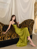 Chartreuse satin maxi dress, seated evening look