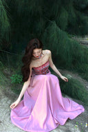 Vogsion Thalassa Striped Strapless Corset Maxi Dress – real customer wearing striped corset top and pink velvet maxi skirt in elegant summer resort outfit, 2026 beach vacation style with global fast shipping