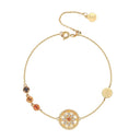 Gold bracelet with decorative elements on a white background