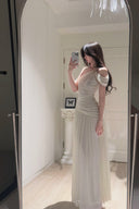 Vogsion Signature Pleated Draped Shoulder Dress in Ivory – elegant white pleated draped shoulder maxi dress worn by real customer, off shoulder formal evening gown 2026 trend