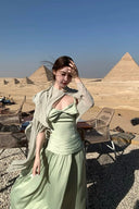 Vogsion Sage Green Ruched Bow Front Maxi Vacation Dress back view with shawl at Giza Pyramids worn by real customer