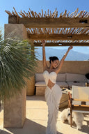 Vogsion ivory strapless cut out ruched maxi dress worn by real customer at seaside resort
