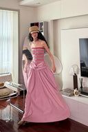 Vogsion Thalassa Striped Strapless Corset Maxi Dress – real customer wearing striped corset top and pink velvet maxi skirt in elegant summer resort outfit, 2026 beach vacation style with global fast shipping