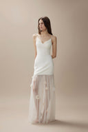 Vogsion Aurelia white corset dress with 3D floral tulle skirt on customer at luxury dinner, 2026 fashion trends.