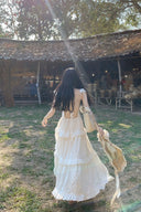 vogsion moonlight white backless long dress for beach wedding, elegant feminine silhouette back view.