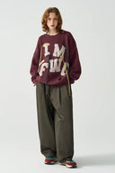 Vogsion “IM YF/WG” Hand-Embroidered Statement Knit Sweater