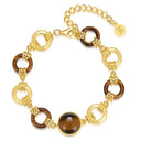 Gold and brown bracelet on a white background