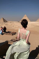 Vogsion Sage Green Ruched Bow Front Maxi Dress with Sheer Shawl at desert cafe worn by real customer near Pyramids