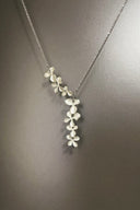 Floral necklace on a dark gray background