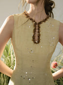 Vogsion Élan Butter Yellow Garden Party Maxi Dress with beaded neckline, sequin embellishments, and linen-look texture styled in a sunlit garden by a normal customer