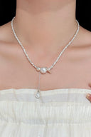 Vogsion Céleste Pearl Lariat Necklace worn by a person on a plain background
