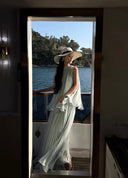 Vogsion Elysian Tiered Pleated Chiffon Maxi Dress in soft seafoam blue – flowy vacation resort wear summer maxi dress with tiered ruffles, worn by real customer on yacht, lightweight pleated chiffon elegant beach dress with global fast shipping