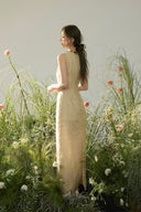 Vogsion Élan Butter Yellow Garden Party Maxi Dress with beaded neckline, sequin embellishments, and linen-look texture styled in a sunlit garden by a normal customer