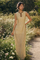 Vogsion Élan Butter Yellow Garden Party Maxi Dress with beaded neckline, sequin embellishments, and linen-look texture styled in a sunlit garden by a normal customer