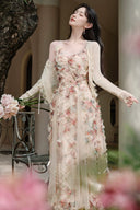 Vogsion Elysian Rose floral maxi dress worn by customer in a sunlit garden