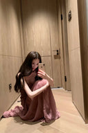 Vogsion OUDE 100% Silk Smocked Pleated Maxi Dress in Smoke Lavender or Soft Pink – real Vogsion customer wearing elegant spaghetti strap silk maxi with smocked bodice, ruffle trim and flowing pleated skirt, global fast shipping