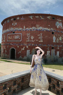Vogsion Dawning Floral Corset Midi Dress featuring a blue and white boho floral pattern and tie straps, shown on a customer in a scenic vacation setting
