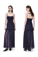 Vogsion OUDE 100% Silk Smocked Pleated Maxi Dress in Smoke Lavender or Soft Pink – real Vogsion customer wearing elegant spaghetti strap silk maxi with smocked bodice, ruffle trim and flowing pleated skirt, global fast shipping