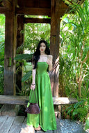 Vogsion Lime Green Maxi Dress for Women 2026 Summer - Real customer wearing flowy spaghetti strap crisscross backless satin vacation beach sundress in tropical garden, not professional model photos