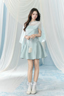 Vogsion Henley Slinky Drape Pearl Cape Mini & Maxi Dress in Light Blue worn by real Vogsion customer – authentic 2026 cape dress trend with pearl embellishments