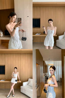 Vogsion 3D Floral Rose Embroidered White Mini Dress on real customer in modern home setting, spaghetti strap little white dress for bridal shower rehearsal dinner party, floral embroidered mini dress with black chain bag