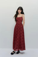 Model in crimson embroidered cut-out long dress, sleeveless autumn maxi dress styled for chic fall to winter outfits and vintage feminine looks.