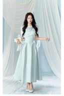 Vogsion Henley Slinky Drape Pearl Cape Mini & Maxi Dress in Light Blue worn by real Vogsion customer – authentic 2026 cape dress trend with pearl embellishments