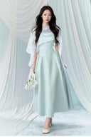 Vogsion Henley Slinky Drape Pearl Cape Mini & Maxi Dress in Light Blue worn by real Vogsion customer – authentic 2026 cape dress trend with pearl embellishments