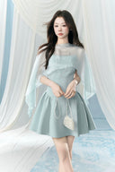 Vogsion Henley Slinky Drape Pearl Cape Mini & Maxi Dress in Light Blue worn by real Vogsion customer – authentic 2026 cape dress trend with pearl embellishments