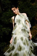 Vogsion sage green tiered ruffle maxi dress featuring a high halter neckline, botanical floral print on sheer tulle, and a voluminous floor-length skirt.