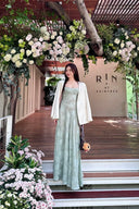 Vogsion Sieren Pistachio Floral Devoré Jacquard Maxi Gown featuring an internal corset bodice and lace-up back, styled for a luxury destination wedding.