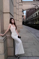 Vogsion lace corset maxi gown with structured waist and sparkle beading, soft portrait pose
