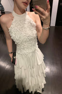 Vogsion Luna Blossom Tiered Ruffle Halter Dress in white with 3D floral appliqué and cascading ruffle tiers – worn by real everyday customer on elegant staircase, authentic fit and styling, 2026 wedding guest dress trend