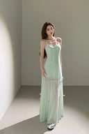Elegant sheer maxi dress with bow ties that transform into midi and mini lengths, perfect as a cocktail dress, vacation outfit, or wedding guest dress.