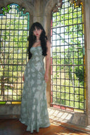 Vogsion Sieren Pistachio Floral Devoré Jacquard Maxi Gown featuring an internal corset bodice and lace-up back, styled for a luxury destination wedding.