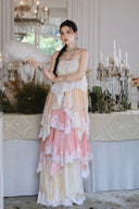 Vogsion Seraphina tiered lace maxi dress in pastel pink and cream, featuring layered ruffles and delicate lace trim for a romantic, high-fashion princesscore look.