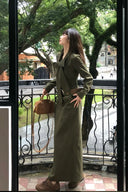 Chic autumn fashion look featuring moss green corduroy maxi dress with statement bow tie and belted waist, perfect full length fall dress for city chic and vintage inspired autumn outfits.