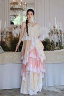 Vogsion Seraphina tiered lace maxi dress in pastel pink and cream, featuring layered ruffles and delicate lace trim for a romantic, high-fashion princesscore look.