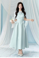 Vogsion Henley Slinky Drape Pearl Cape Mini & Maxi Dress in Light Blue worn by real Vogsion customer – authentic 2026 cape dress trend with pearl embellishments