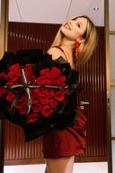 Vogsion wine corset mini dress — customer photo holding red rose bouquet