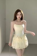 Trendy multiway dress for women, flowing chiffon layers with adjustable bows, styled for summer resort wear, chic evening looks, and fashion influencer outfits.