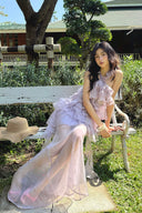 Vogsion Luna Fanned Maxi Dress in Spliced Floral worn by normal customer not professional model | Spring 2026 Kindred Spirit Collection tiered ruffle halter maxi dress in yellow/pink – perfect boho wedding guest look