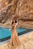 Vogsion Spring Oath Embroidered Tulle Gown in champagne nude featuring floral corset bodice and flowing pleated tulle skirt, styled for destination wedding and evening gala elegance