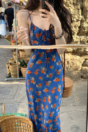 Street style look featuring cobalt blue floral slip dress with spaghetti straps, slim fit silhouette maxi dress for casual chic summer outfit inspiration.