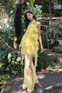 Vogsion Luna Fanned Maxi Dress in Spliced Floral worn by normal customer not professional model | Spring 2026 Kindred Spirit Collection tiered ruffle halter maxi dress in yellow/pink – perfect boho wedding guest look