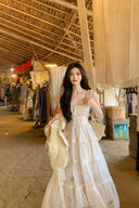 Close-up of the ruched bodice and delicate eyelet lace patterns on the Vogsion tiered sundress.