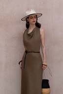 Close-up of draped neckline sleeveless dress in textured fabric with refined vacation styling