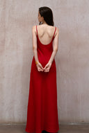 A minimalist 100% linen slip dress with a handcrafted rose detail on the bust and a low open back, designed for summer vacations, weddings, and elegant evening occasions — Last Sunset Rosette Linen Slip Dress available in soft blush pink and deep crimson red.