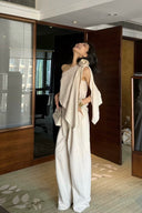 Editorial image of the VOGSION Élan Quiet Luxury Linen Set with premium linen fabric, statement floral shoulder detail, and effortless wide-leg silhouette designed for luxury vacations, brunch dates, and timeless minimalist dressing.