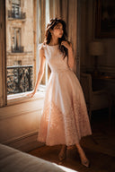 Petite-friendly blush pink midi dress with laser cut lace skirt, timeless feminine occasion dress for weddings and garden parties